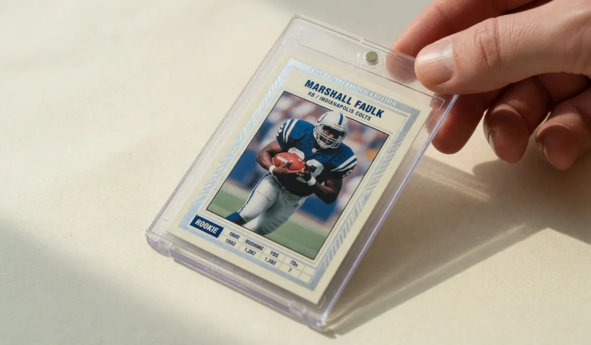 Single football trading card in a transparent sleeve